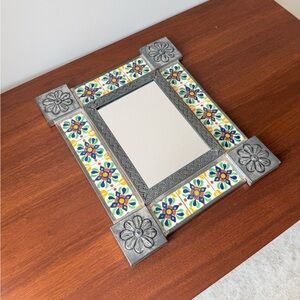 colorful Mexican tin art mirror has inset Talavera ceramic tiles